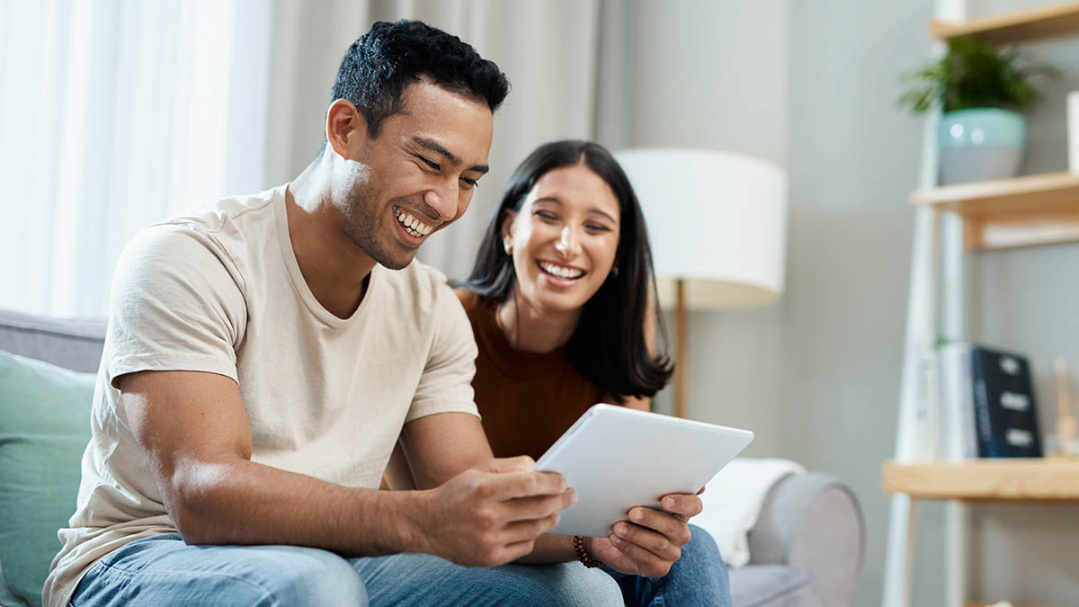 couple looking at a tablet